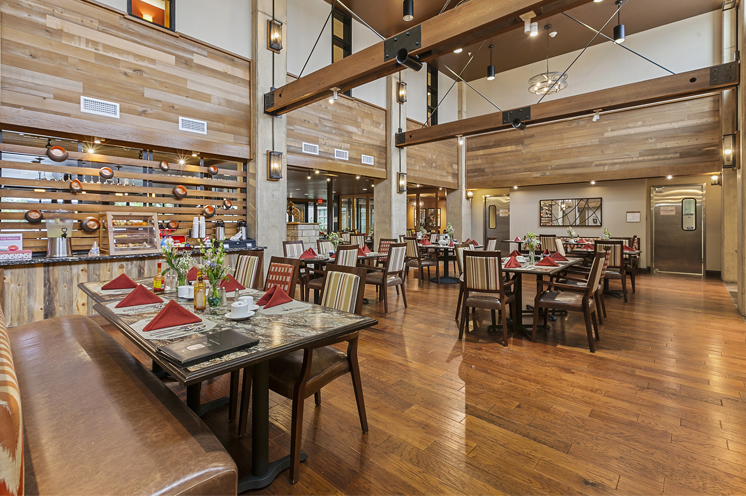 Dining area with seats and tables.