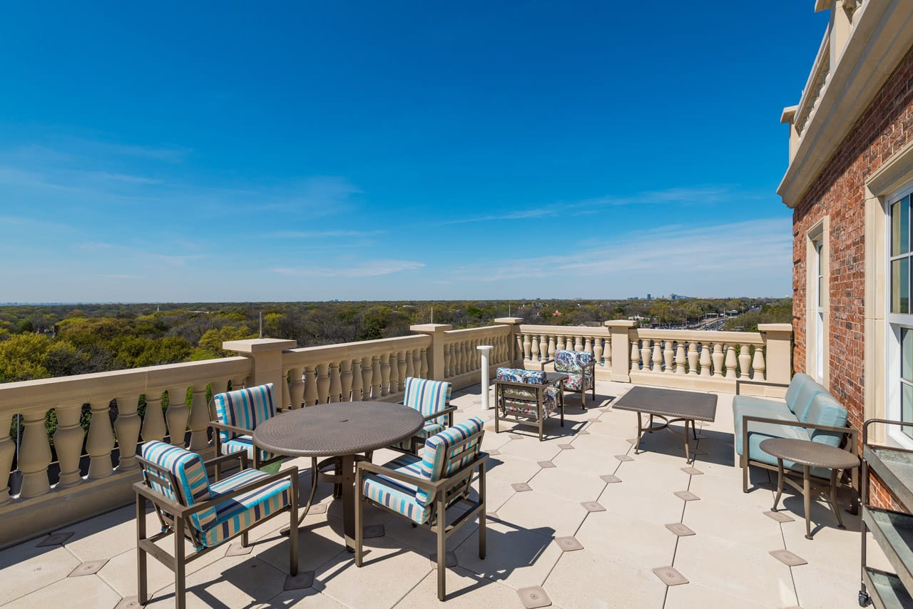 The Preston of The Park Cities outside balcony area with outside seating and tables