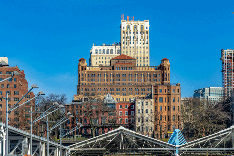 The Watermark at Brooklyn Heights exterior against a blue background from the street.