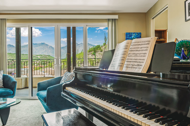 Seating area with piano.