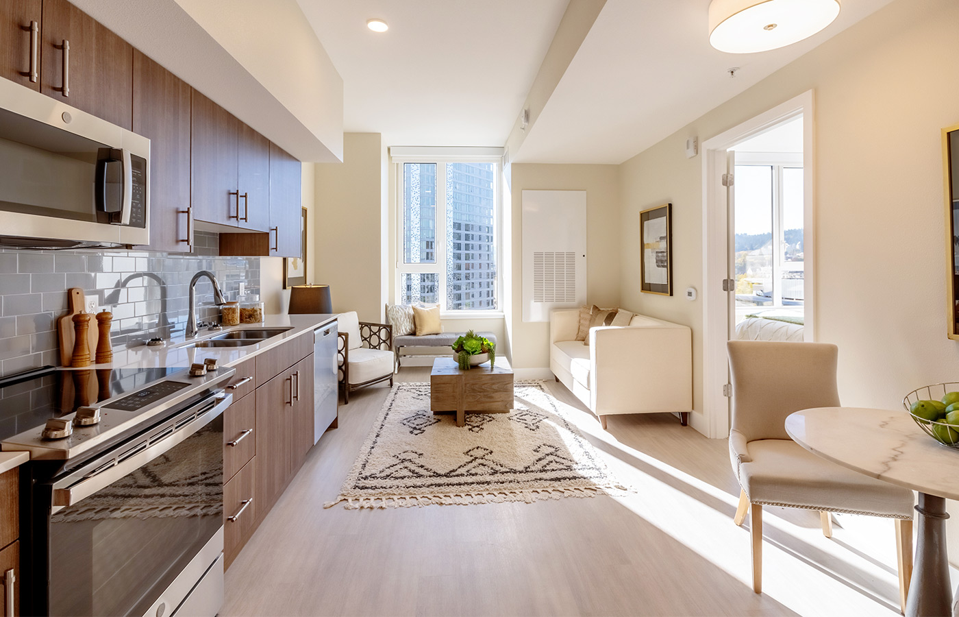 A fully furnished living room kitchen area.