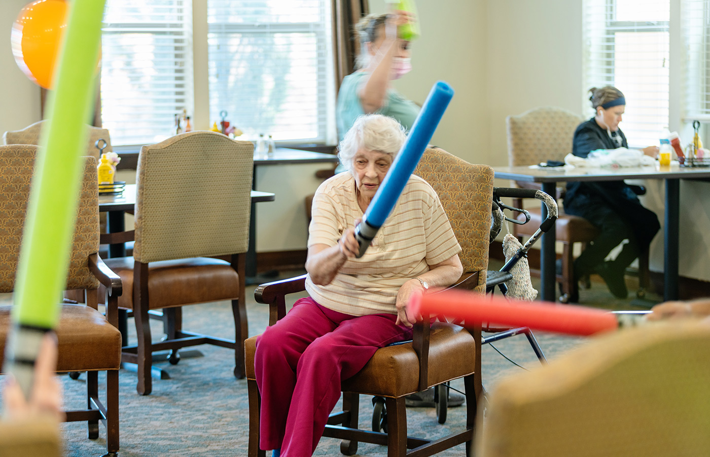 A person swinging a foam wand.