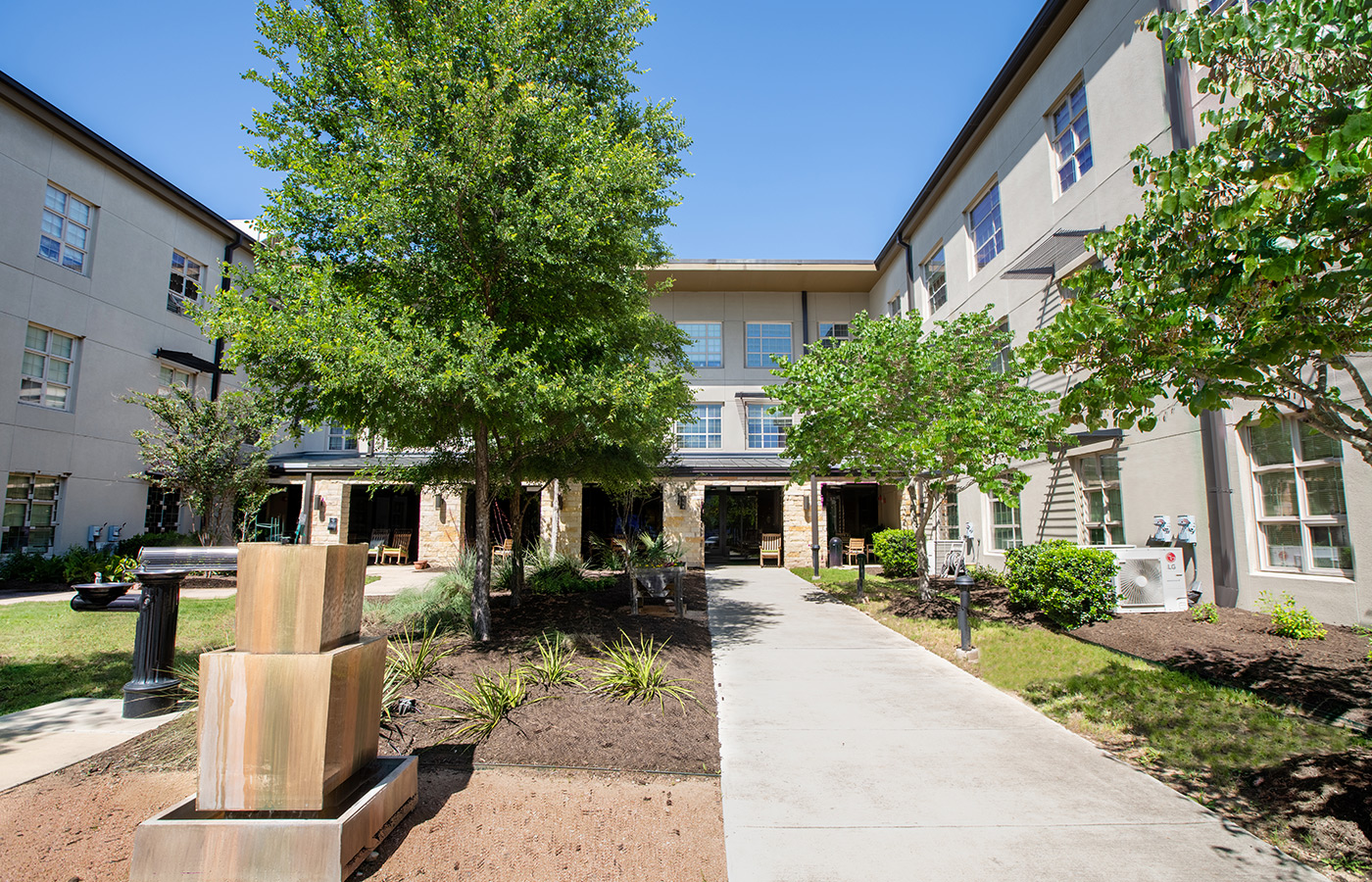 A garden with plants and a walkway.