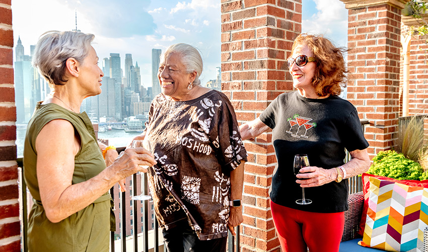 People having drinks on the rooftop.