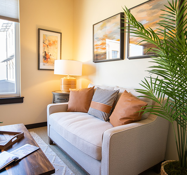 A sofa in an apartment at The Watermark at Cherry Hills.