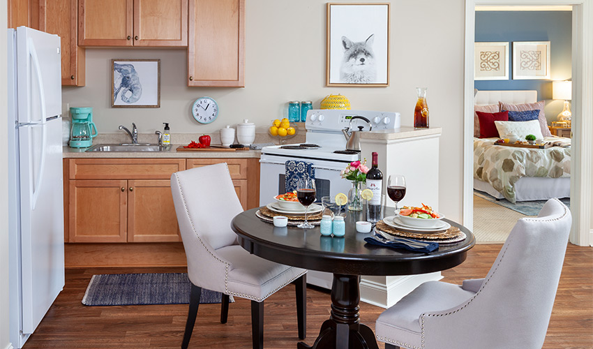 A fully furnished apartment kitchen.