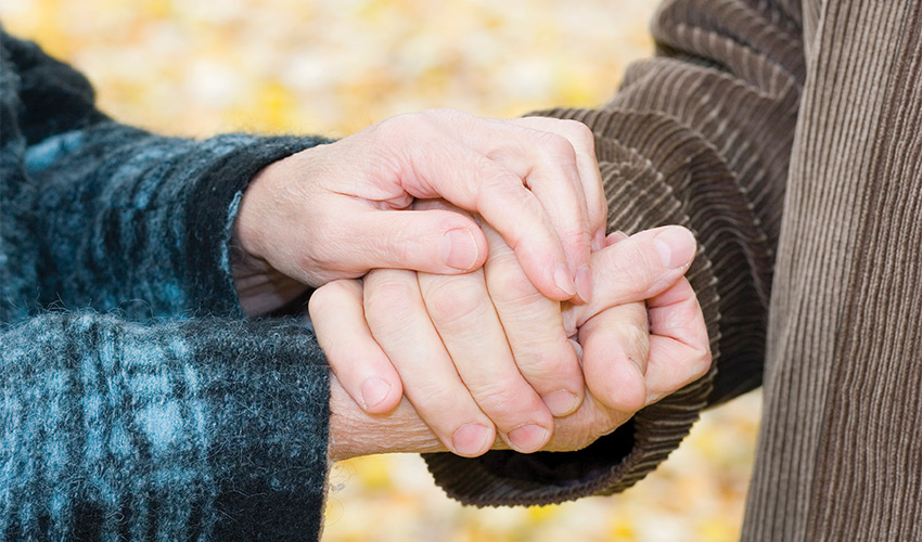 Two people holding hands.