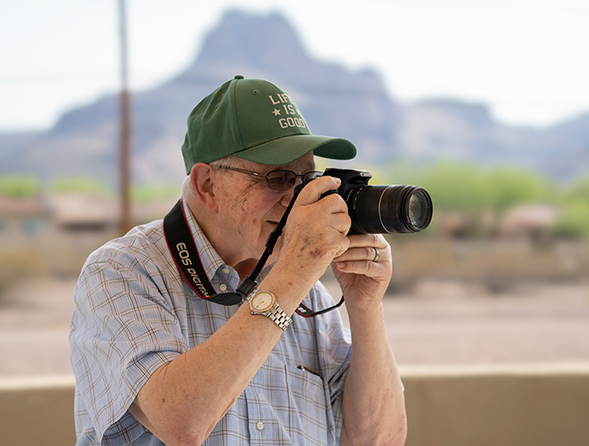 A resident is outside taking photos.