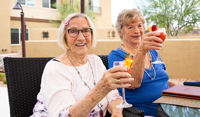 People having a drink on the patio.