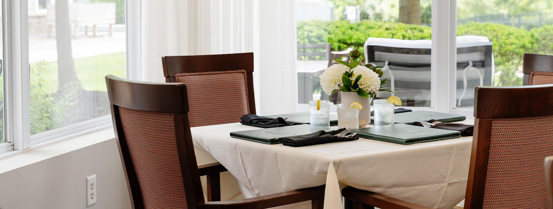 A dining table set for dinner.