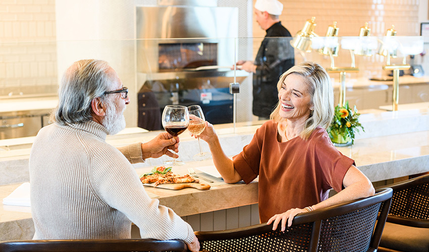 People toasting with wine.