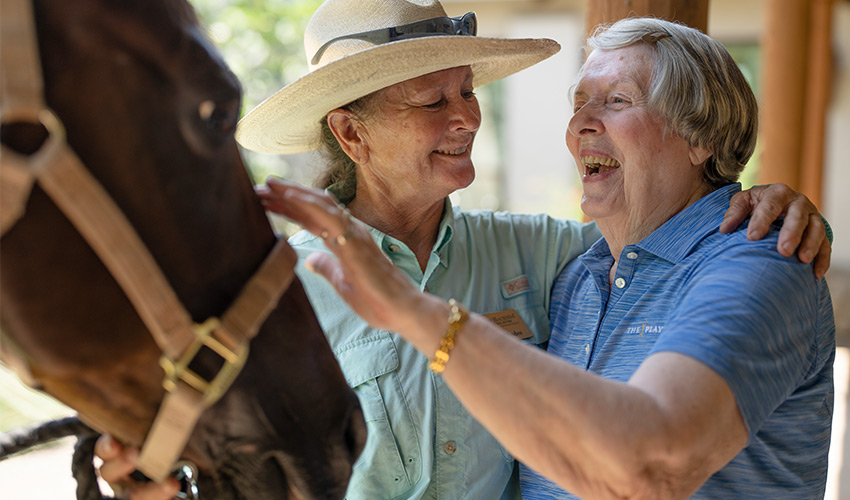 Two people with horse.