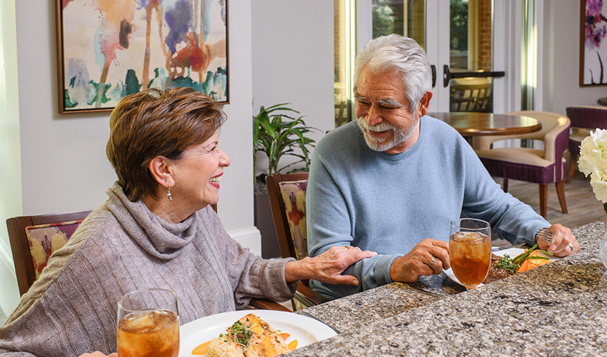 A couple having breakfast at the counter.