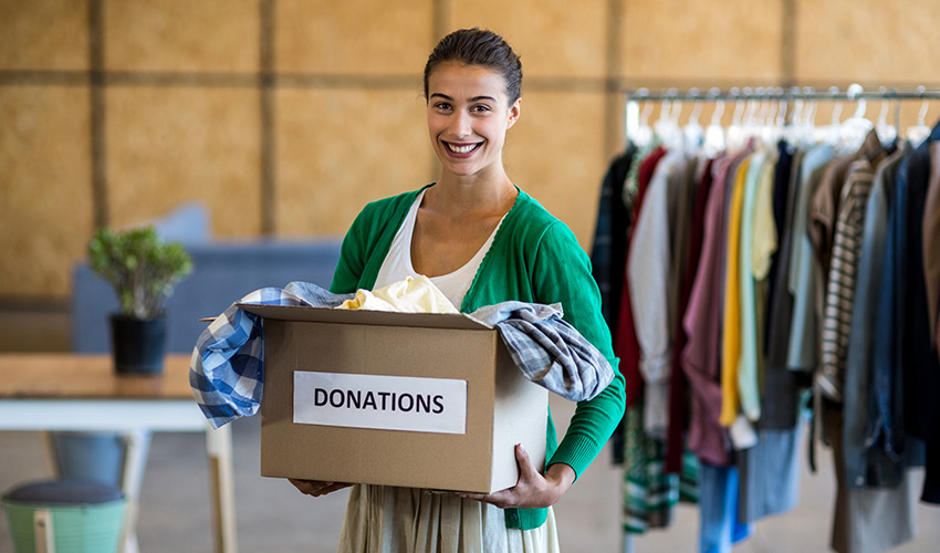 person with a box of donations