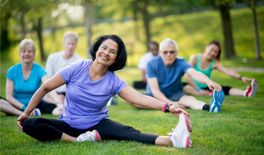 people on the grass stretching