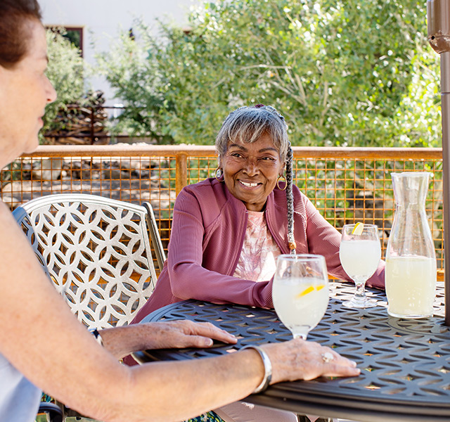 A person having lemonade on the patio.