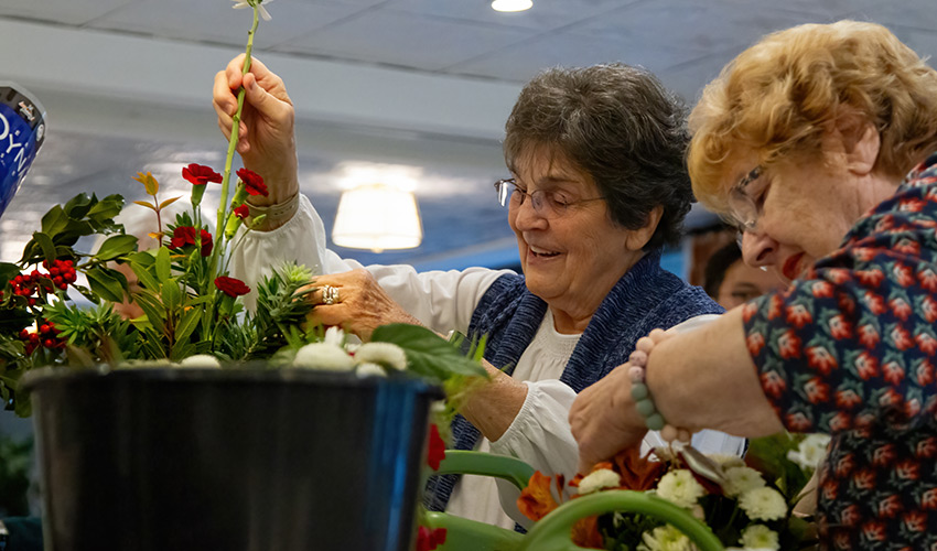 People arranging flowers.