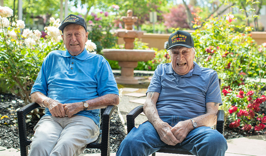 Two people sitting in the garden.