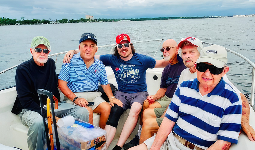 Six people sitting on a boat.