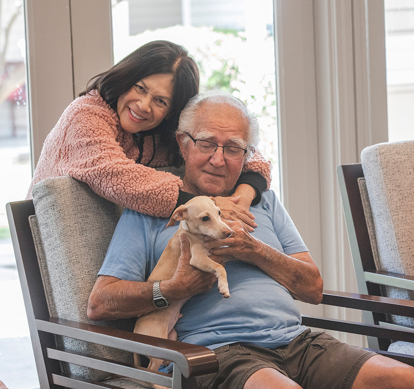 Two residents are hugging.