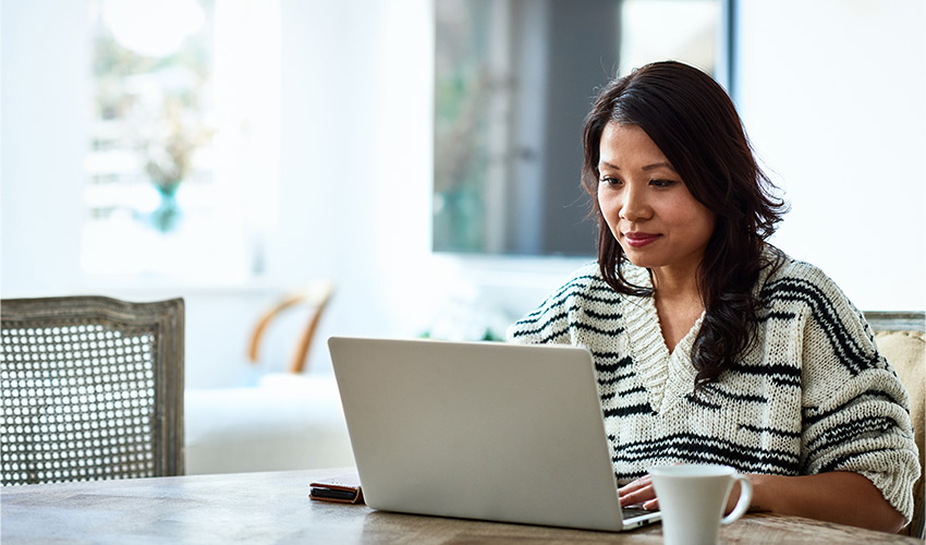 A person on their computer at home.