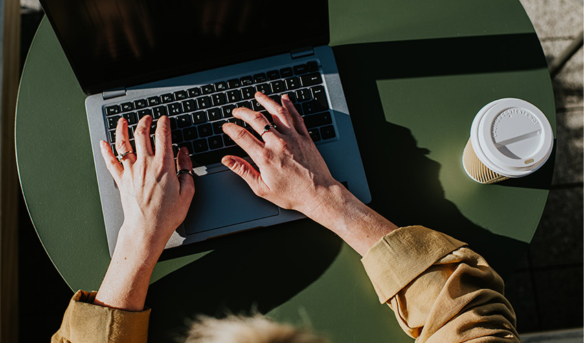 Someone typing on a computer.