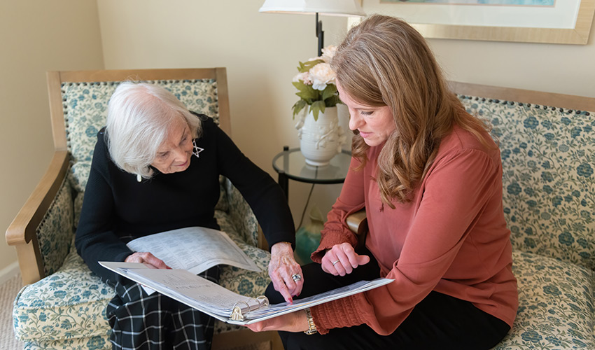 A person helping a resident.