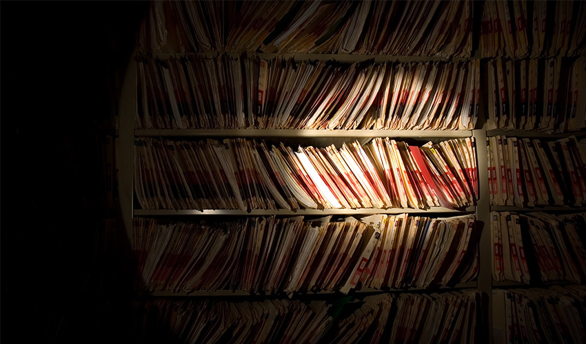 A shelf filled with files.