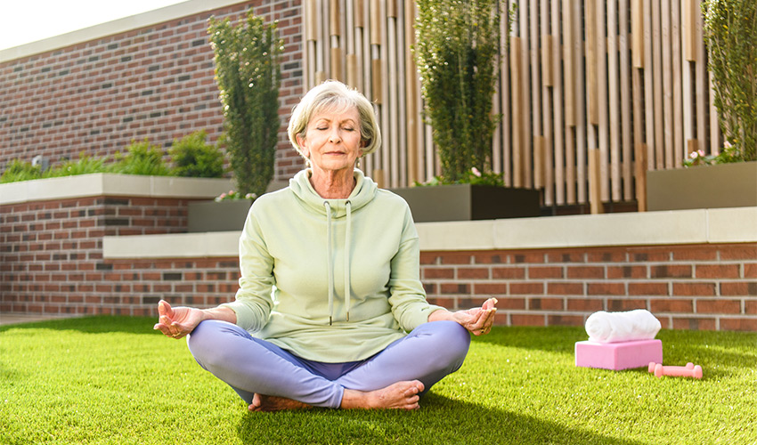 A person meditating outside.