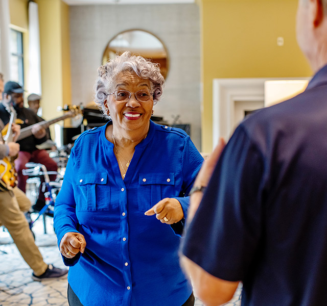 A resident dancing to live music.